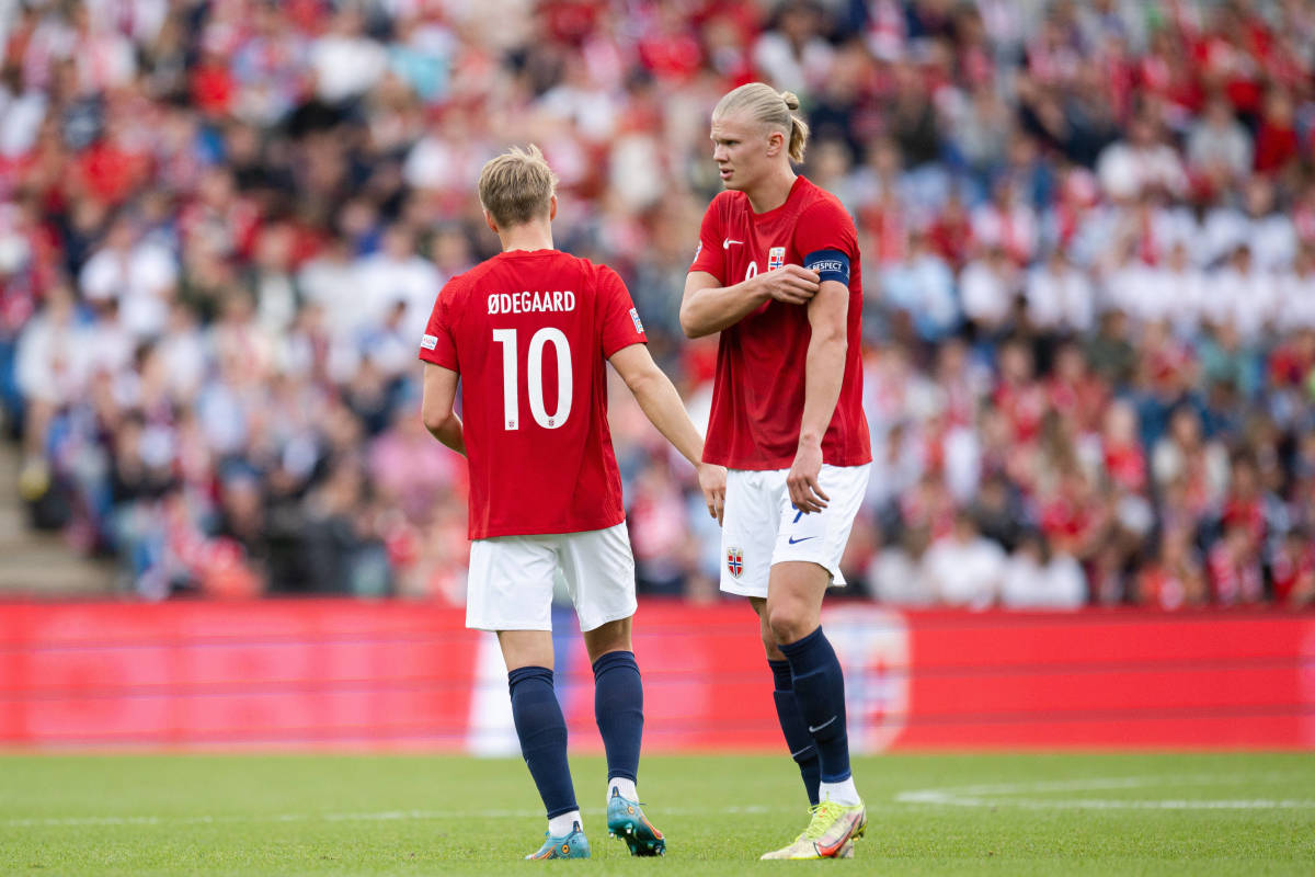 Erling Haaland pictured wearing the Norway captain's armband after taking it from Martin Odegaard (left) during their side's 3-2 win over Sweden in June 2022