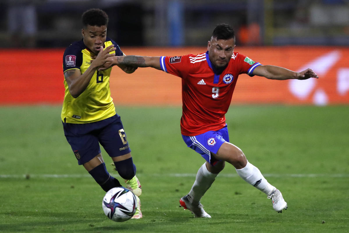 Byron Castillo (left) pictured playing for Ecuador against Chile in a World Cup qualifier for Qatar 2022