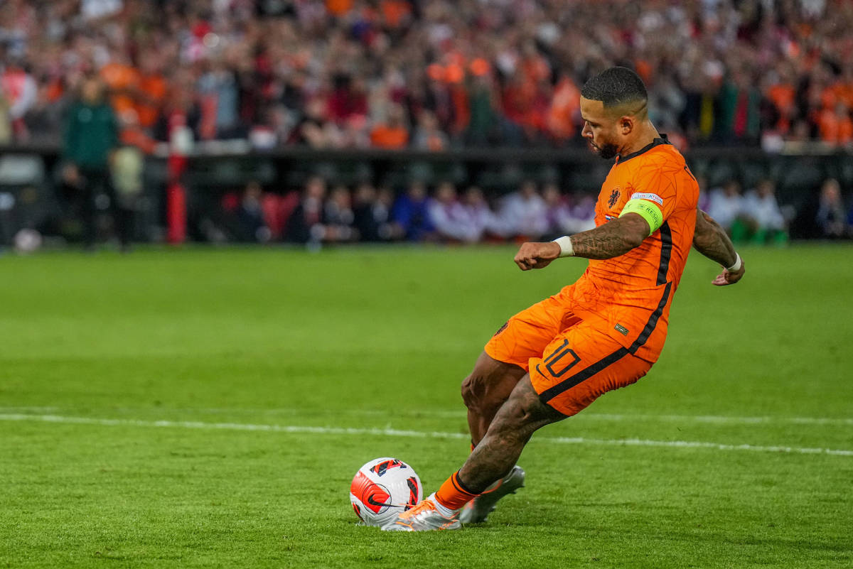 Memphis Depay pictured taking a penalty during Holland's 2-2 draw with Poland in June 2022