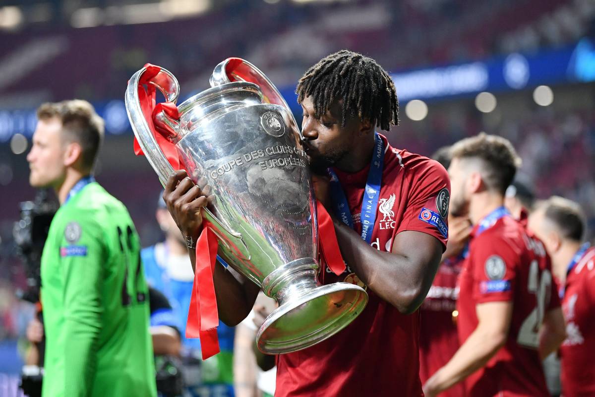 Divock Origi pictured kissing the Champions League trophy after scoring in Liverpool's 2-0 win over Tottenham in the 2019 final