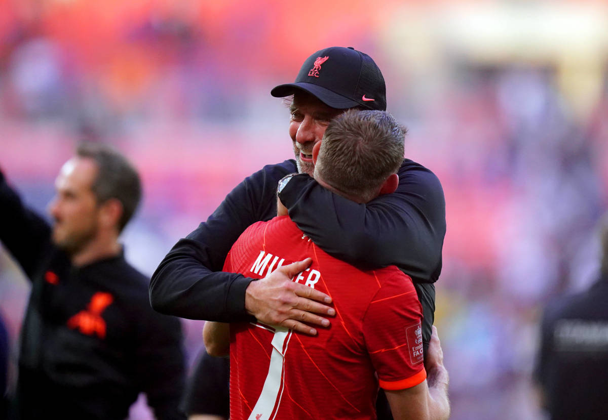 Liverpool manager Jurgen Klopp pictured hugging James Milner after their 2022 FA Cup final win over Chelsea