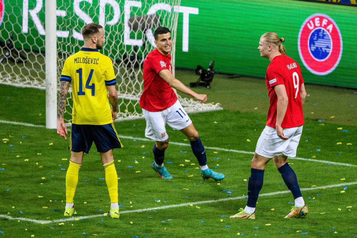 Erling Haaland pictured (right) looking at Sweden defender Alexander Milosevic after scoring for Norway in June 2022