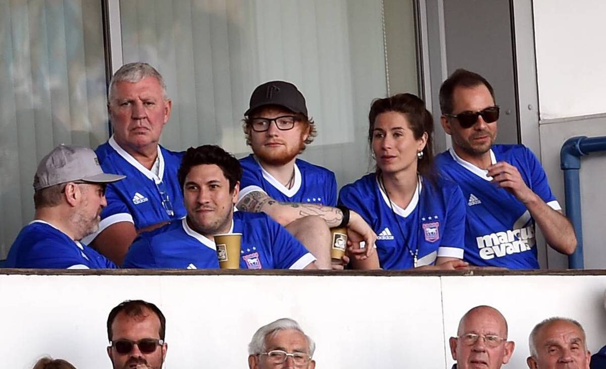 Ipswich Town fan Ed Sheeran pictured (center) watching his team against Aston Villa at Portman Road in 2018