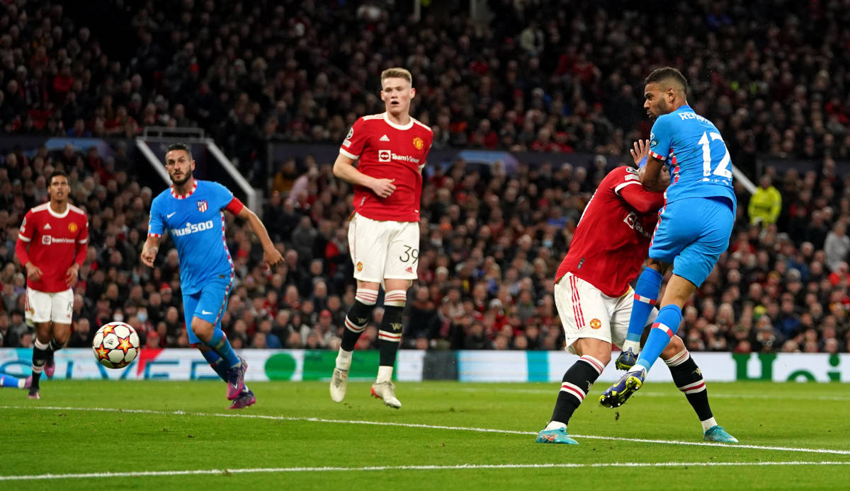 Renan Lodi (right) wins a header to score for Atletico Madrid at Manchester United