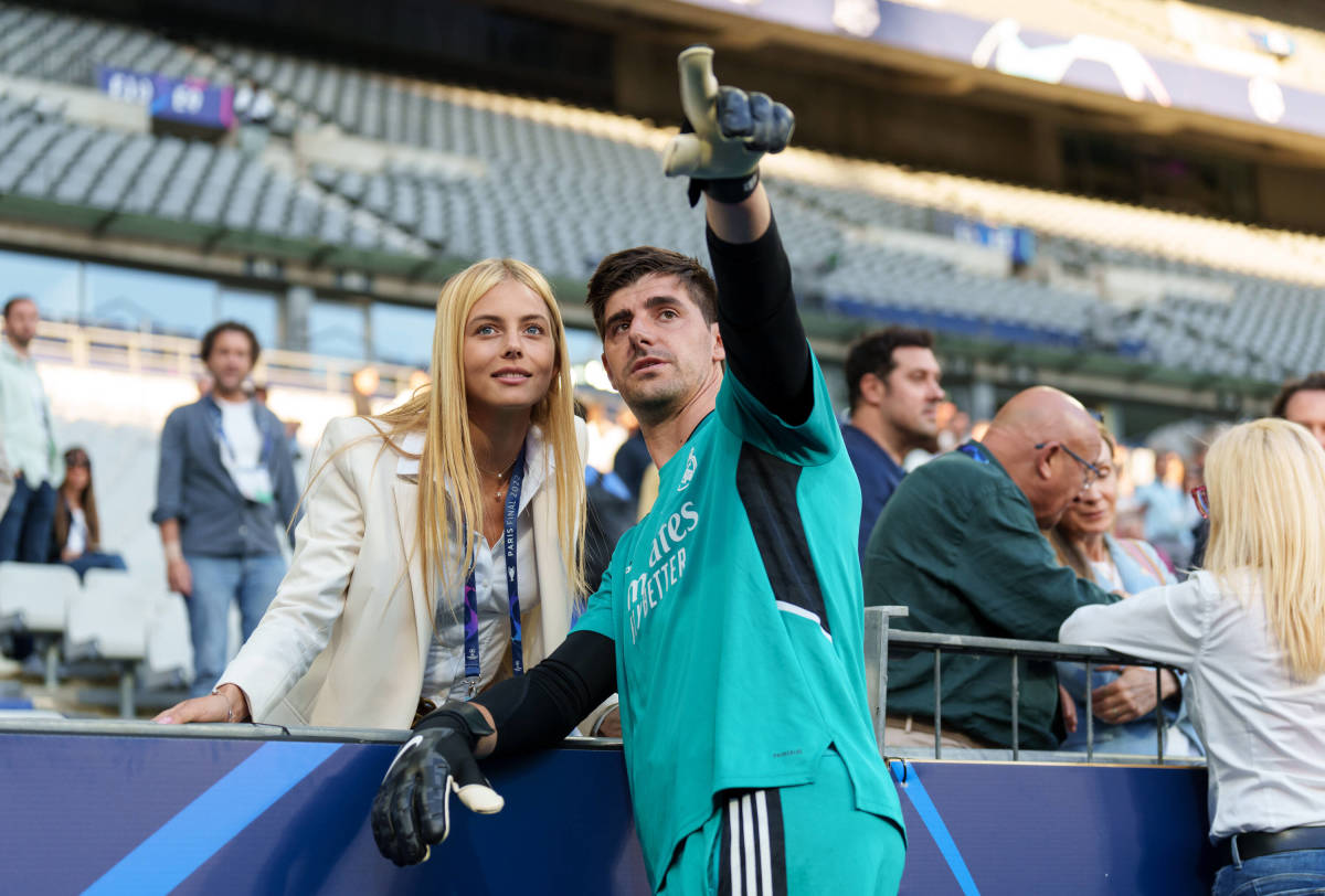 Real Madrid goalkeeper Thibaut Courtois pictured talking to girlfriend Mishel Gerzig at a training session at the Stade de France ahead of the 2022 Champions League final against Liverpool