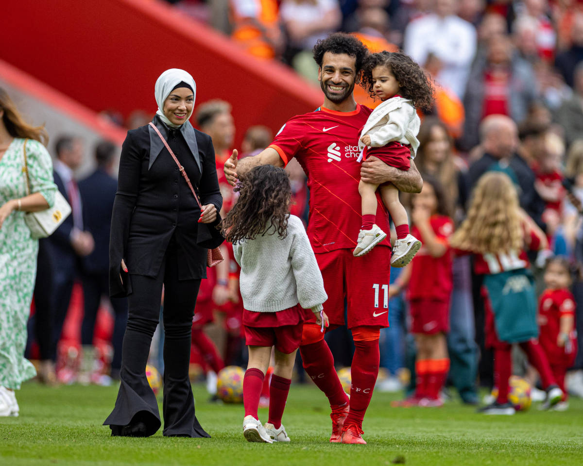 Mo Salah pictured alongside his wife Magi Sadeq and their two daughters on the pitch at Anfield after Liverpool's final Premier League game of the 2021/22 season