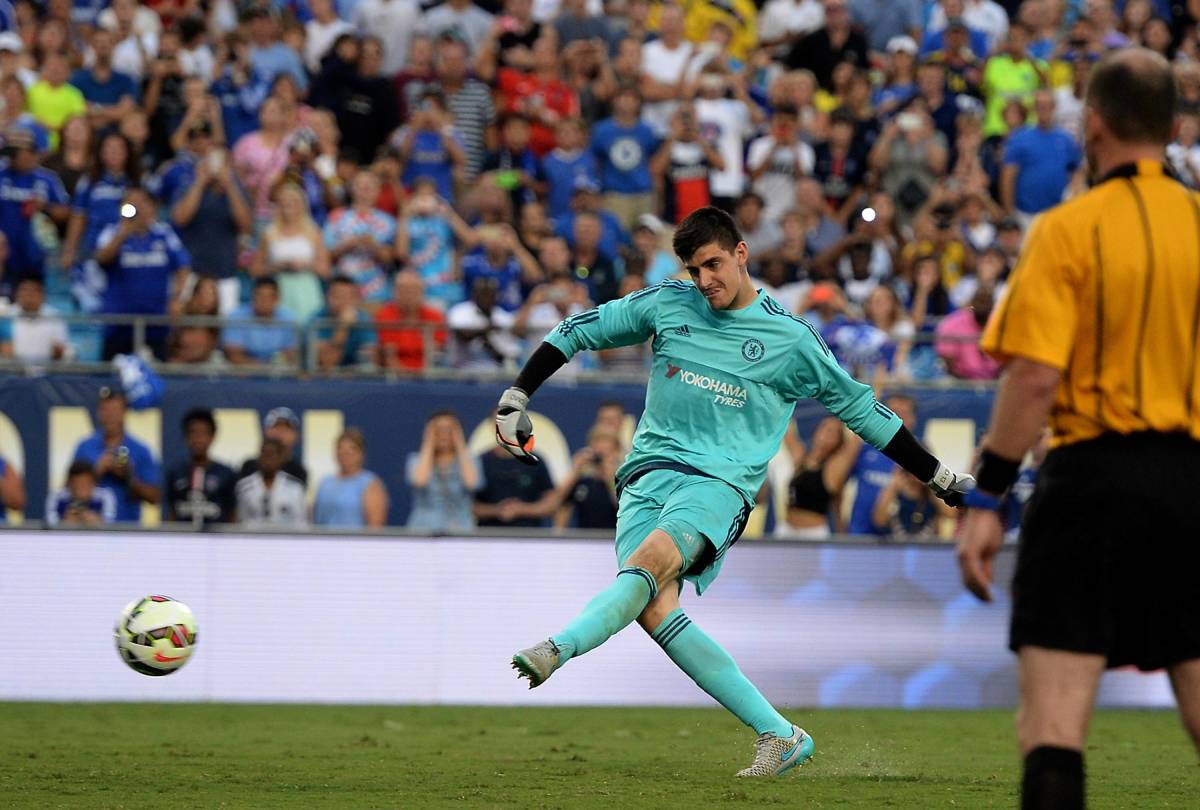 Thibaut Courtois pictured scoring the winning penalty for Chelsea in their shootout victory over PSG in a 2015 pre-season friendly
