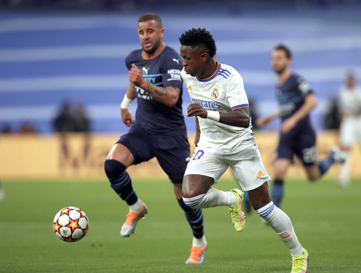 Vinicius Junior (right) races with Kyle Walker during Real Madrid's Champions League semi-final second leg against Manchester City in May 2022