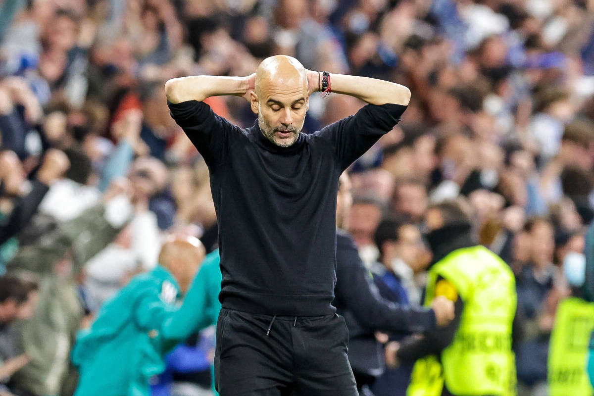 Pep Guardiola pictured looking dejected during Manchester City's 3-1 defeat at the hands of Real Madrid in May 2022