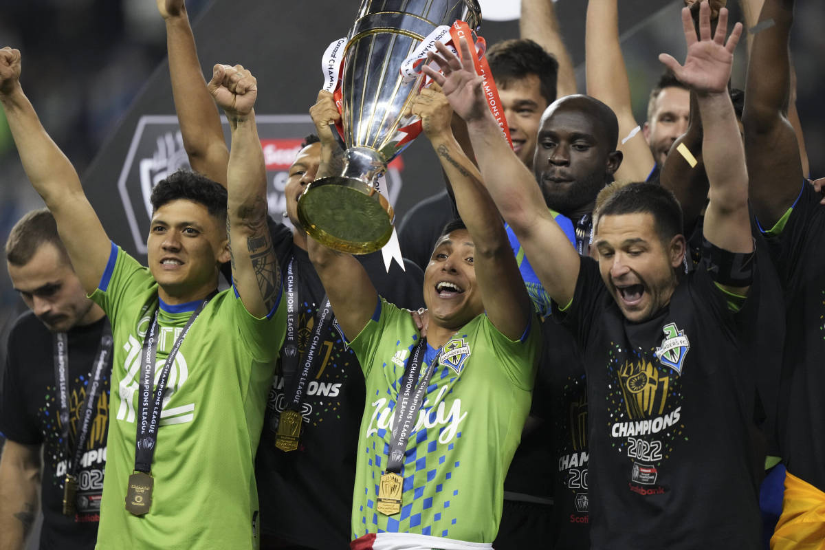 Seattle Sounders striker Raul Ruidiaz pictured lifting the CONCACAF Champions League trophy after scoring twice in a 3-0 win over Pumas