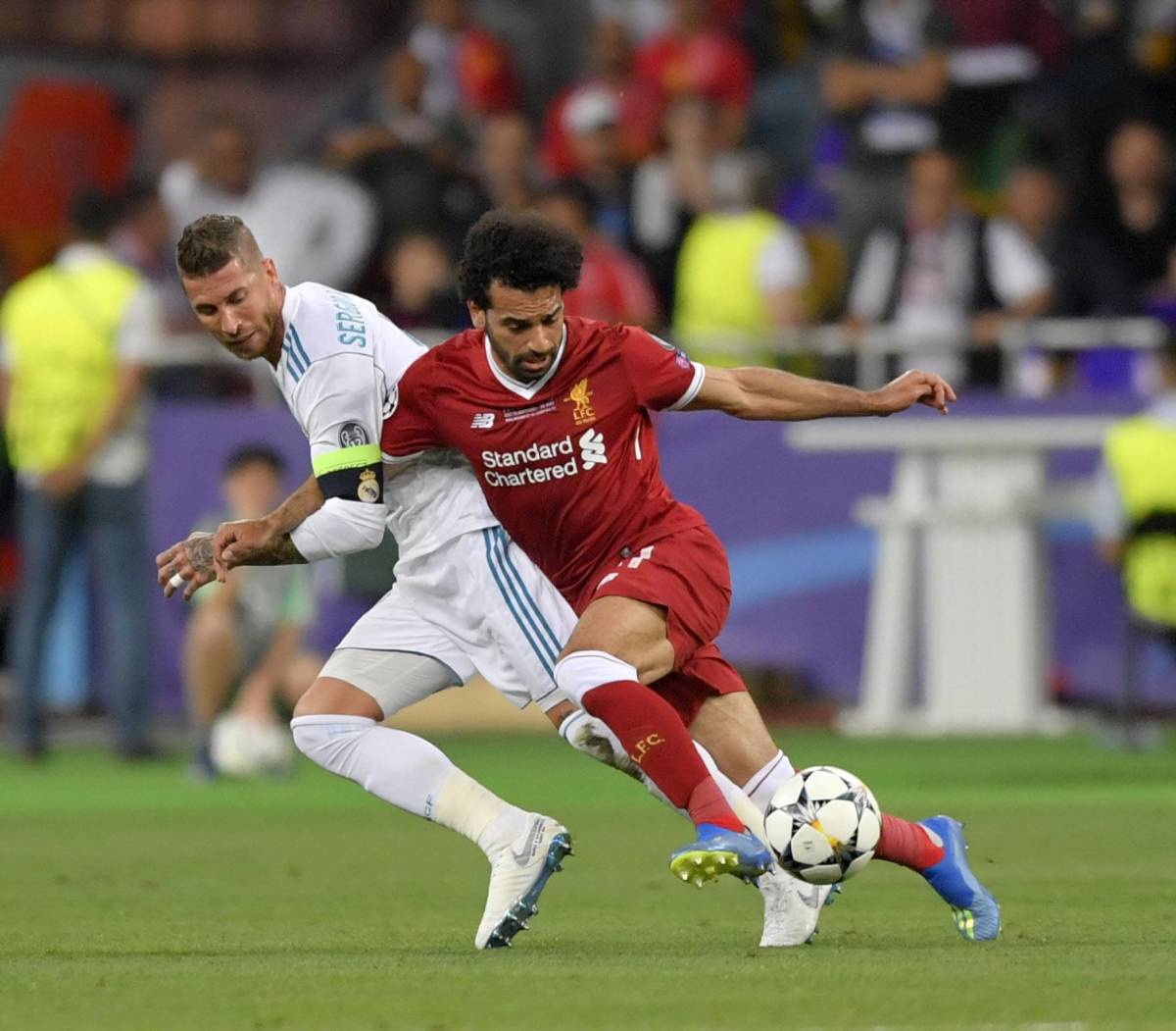 Mo Salah (right) pictured falling to the floor with Sergio Ramos during the 2018 Champions League final