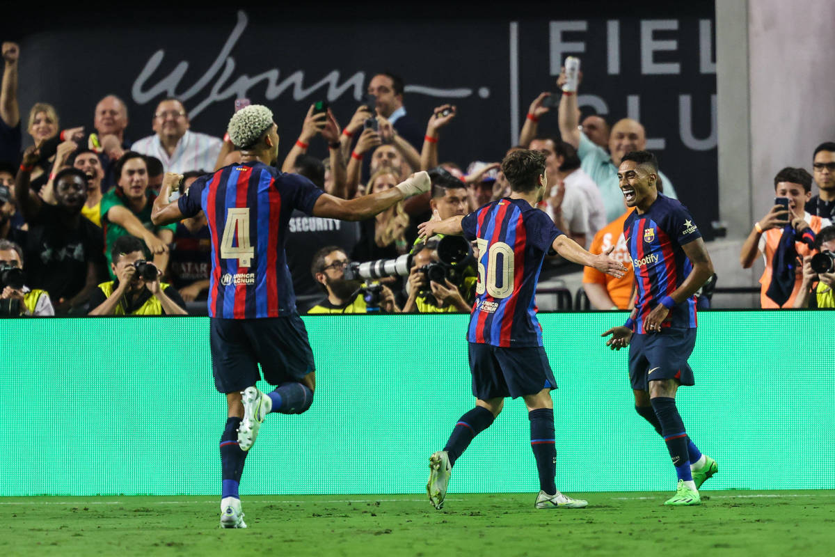 Raphinha (right) pictured celebrating with his Barcelona teammates after scoring against Real Madrid in Las Vegas in July 2022
