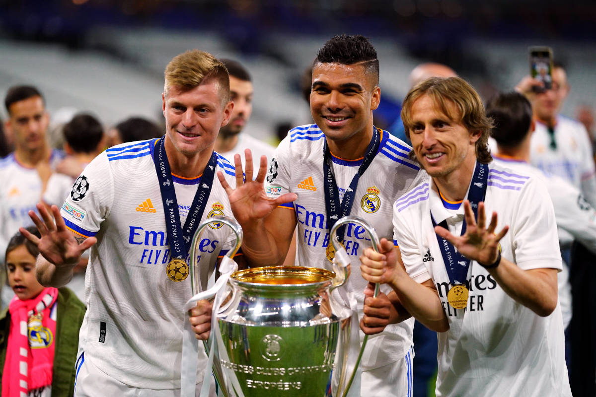 Toni Kroos (left) Casemiro (center) and Luka Modric (right) pictured celebrating after winning their fifth Champions League title with Real Madrid