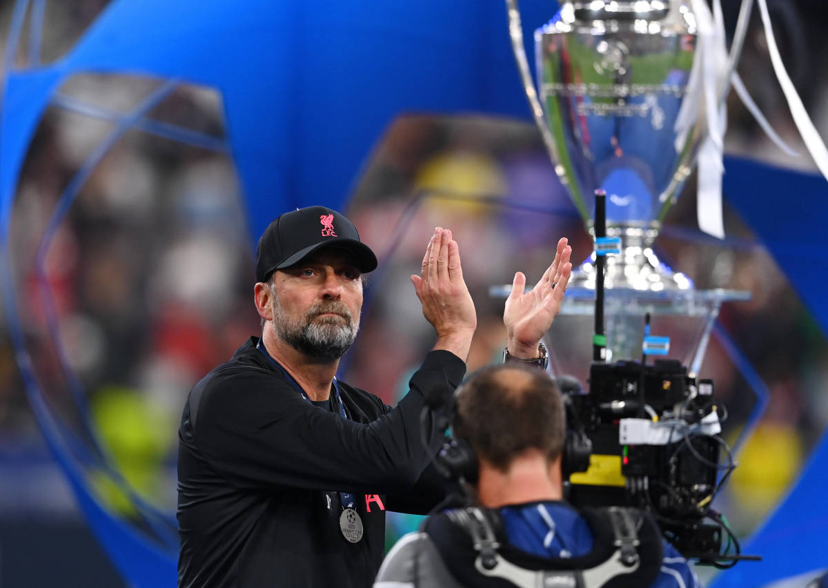 Jurgen Klopp pictured walking past the Champions League trophy after Liverpool's 1-0 loss to Real Madrid in the 2022 final in Paris