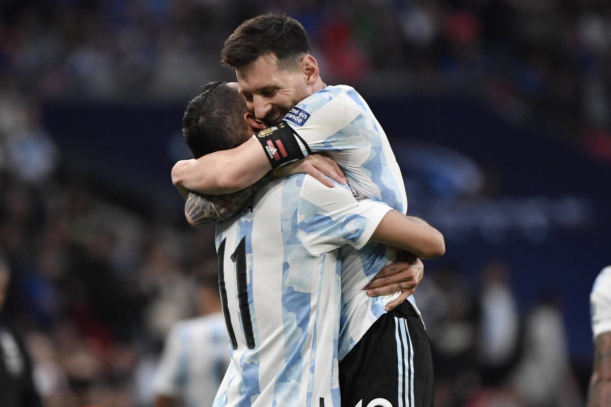 Angel Di Maria (left) is hugged by Lionel Messi after scoring for Argentina in 2022's Finalissima match against Italy