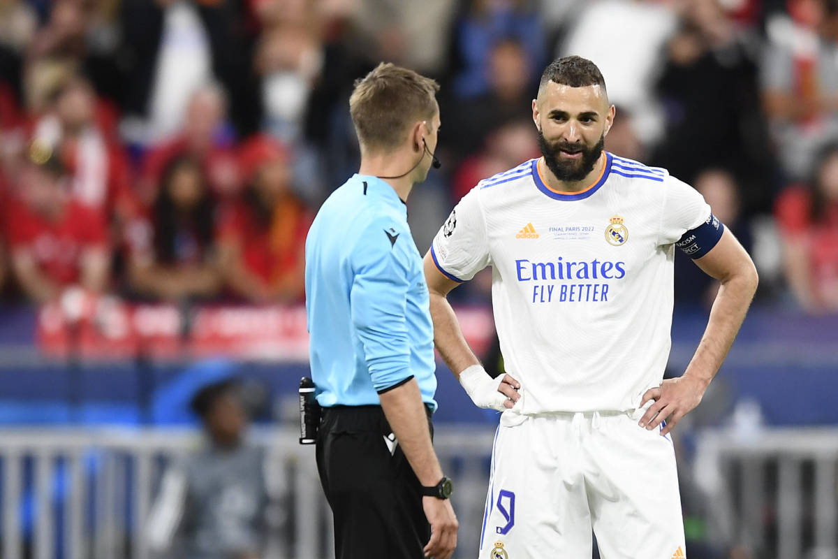 Karim Benzema (right) pictured talking to referee Clement Turpin during the 2022 Champions League final in Paris