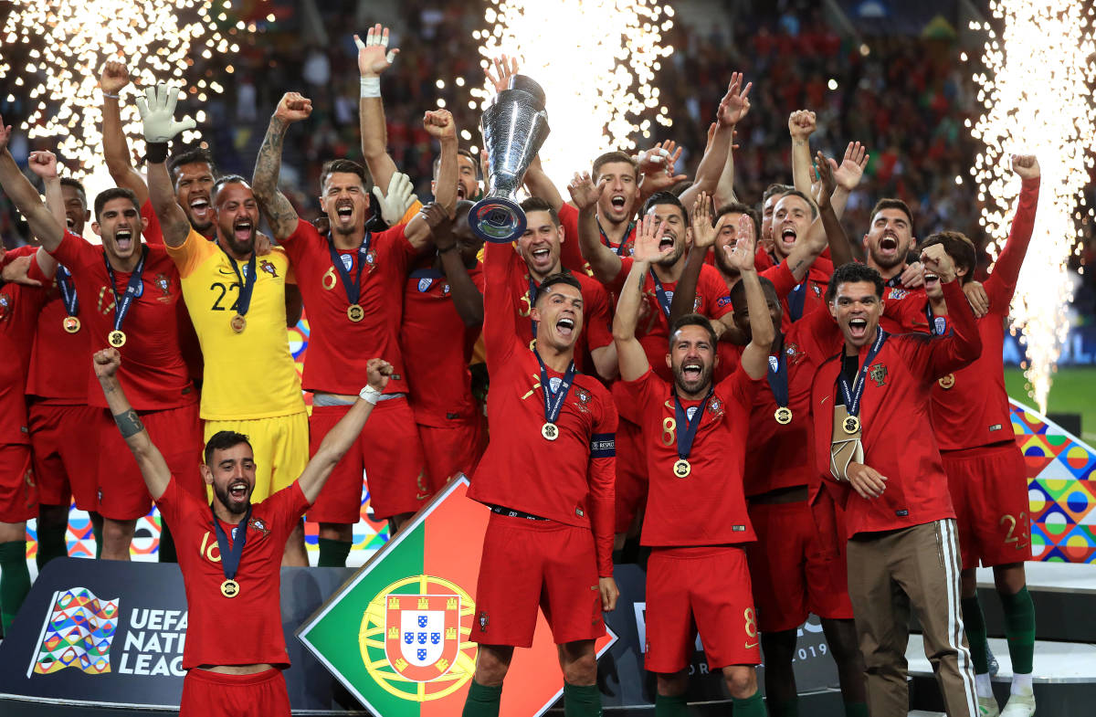 Portugal's players celebrate with their trophy after becoming inaugural UEFA Nations League champions in 2019