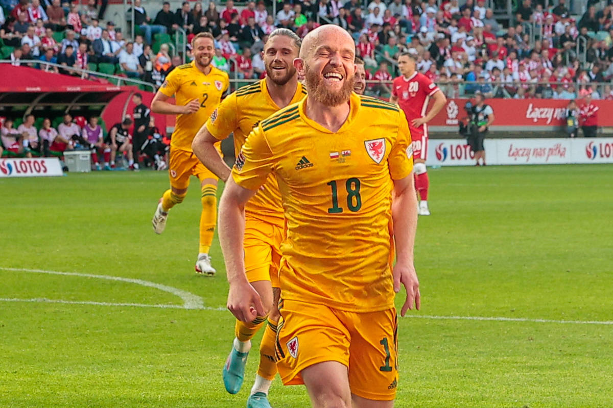 Jonathan Williams pictured celebrating after scoring a goal for Wales against Poland in June 2022
