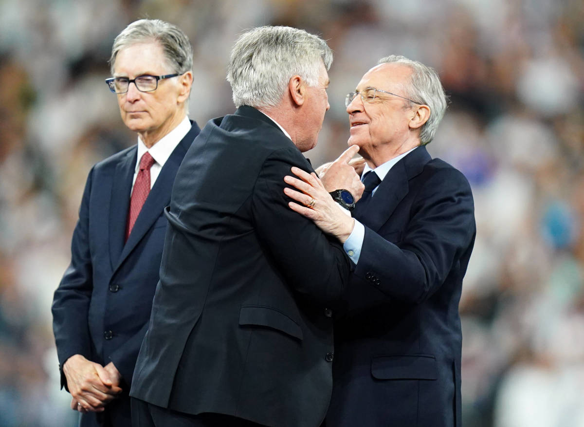 Real Madrid president Florentino Perez (right) and manager Carlo Ancelotti (center) pictured celebrating together after watching their side win the 2022 Champions League final against Liverpool