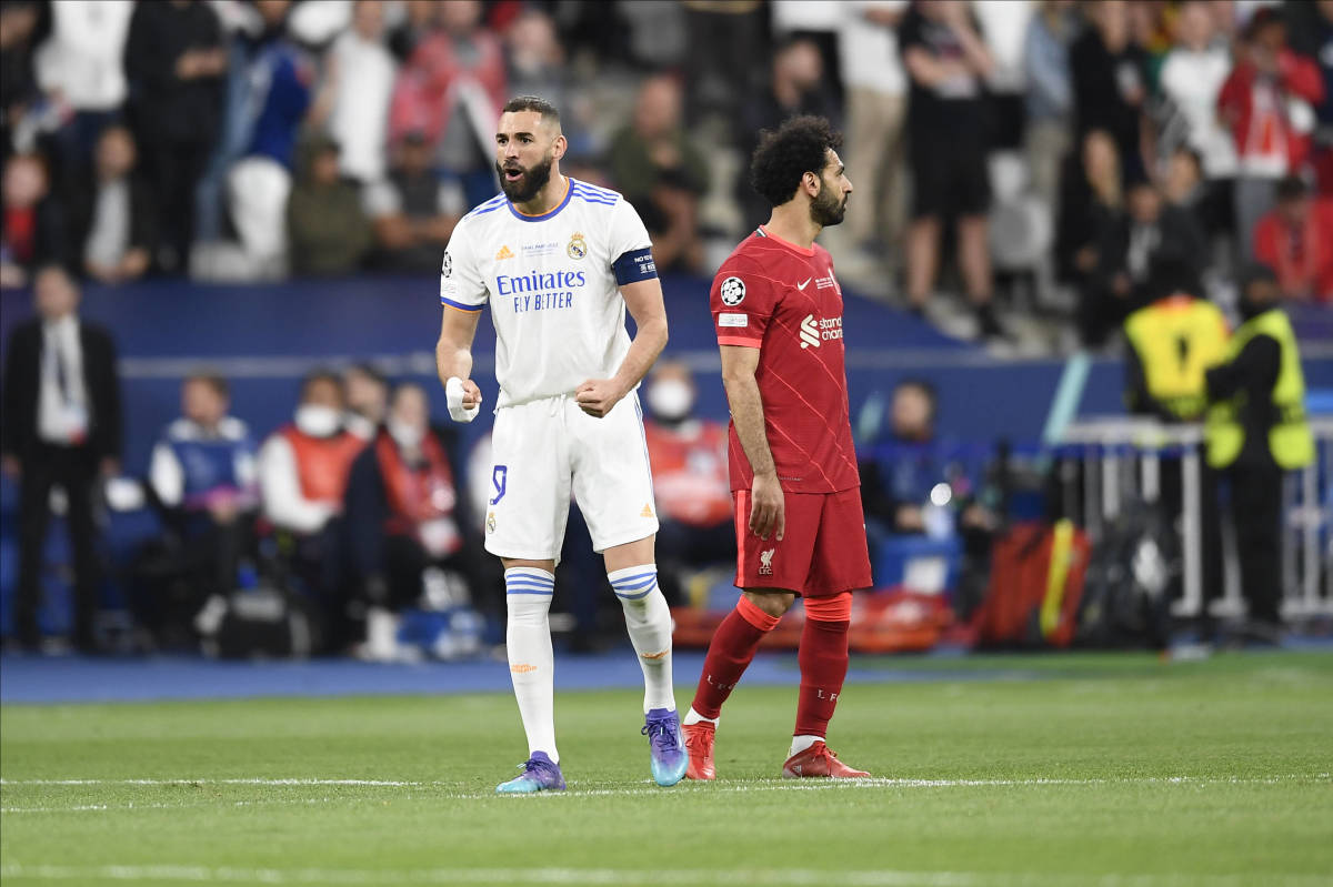 Real Madrid striker Karim Benzema pictured (left) alongside Liverpool's Mo Salah during the Champions League final in May 2022