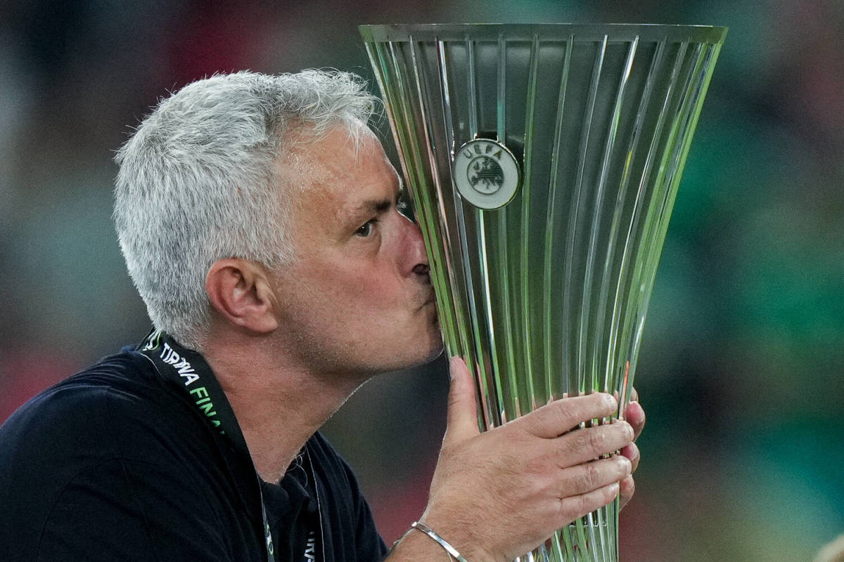 Roma manager Jose Mourinho pictured kissing the UEFA Europa Conference League trophy after his team beat Feyenoord 1-0 in the tournament's first ever final in May 2022