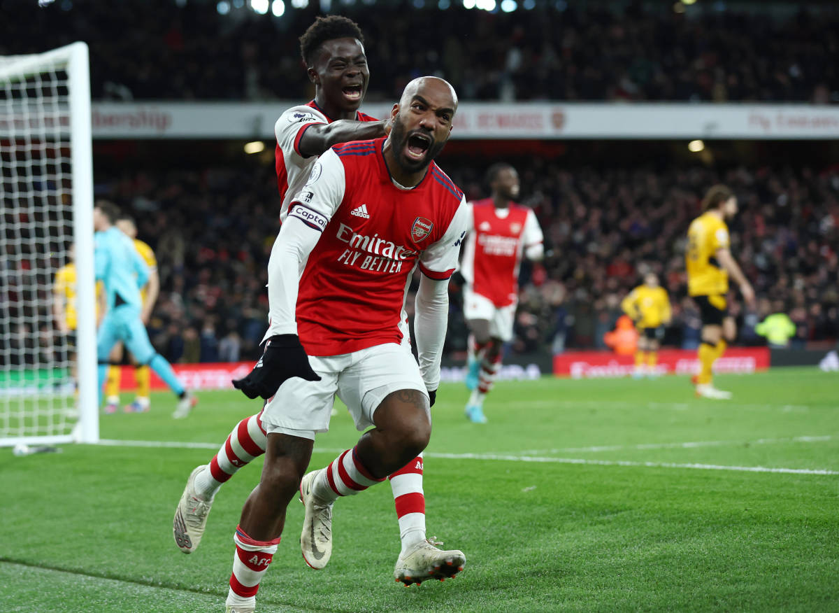 Alexandre Lacazette screams with delight as he celebrates Arsenal's winning goal against Wolves in February 2022