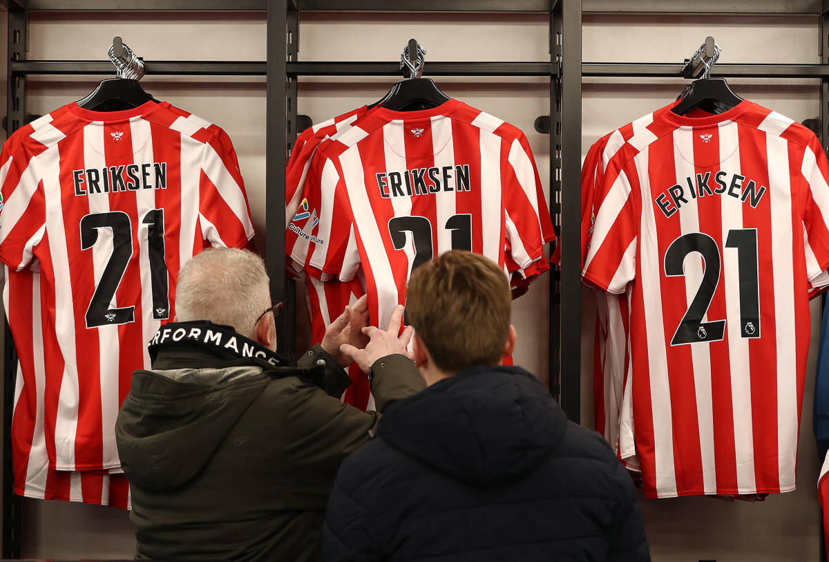 Christian Eriksen shirts with the number 21 are seen on sale at Brentford's club shop in 2022