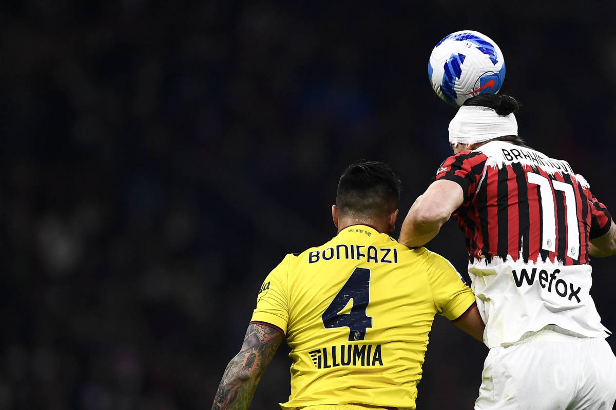 Zlatan Ibrahimovic and Kevin Bonifazi challenge for a header during AC Milan's 0-0 draw with Bologna in April 2022