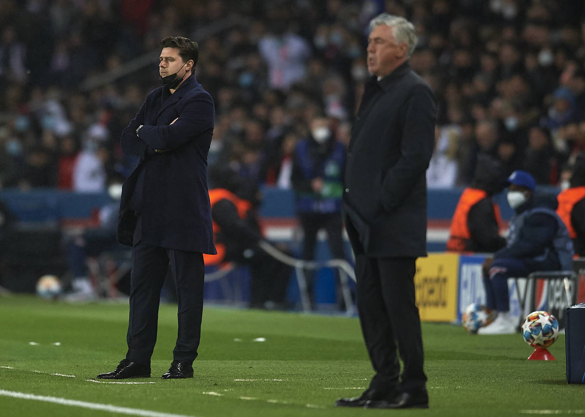 PSG boss Mauricio Pochettino (left) and Real Madrid coach Carlo Ancelotti pictured watching their teams in action during their Champions League last 16 clash in February 2022