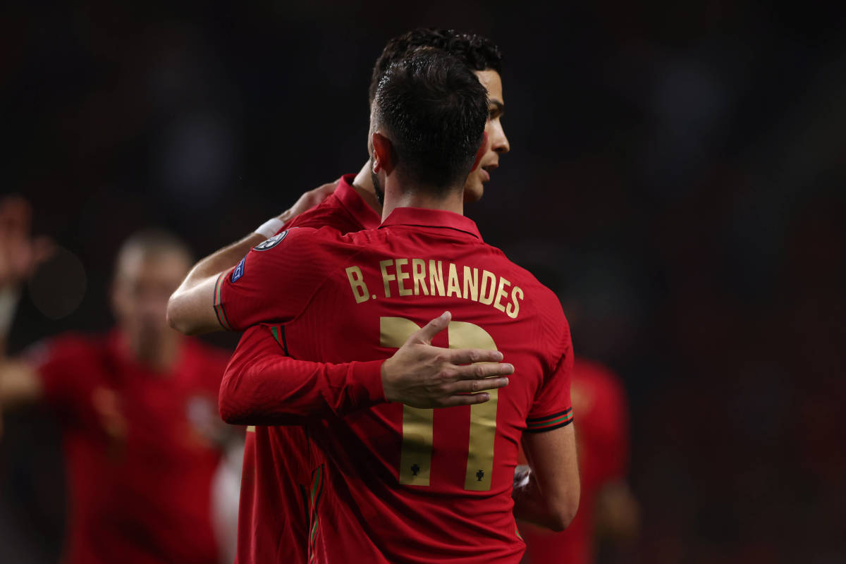 Cristiano Ronaldo embraces Bruno Fernandes during Portugal's 2-0 win over North Macedonia in March 2022