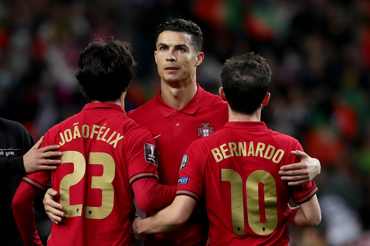 Cristiano Ronaldo celebrates with Joao Felix and Bernardo Silva after Portugal beat Turkey 3-1 in a World Cup qualifying play-off semi-final