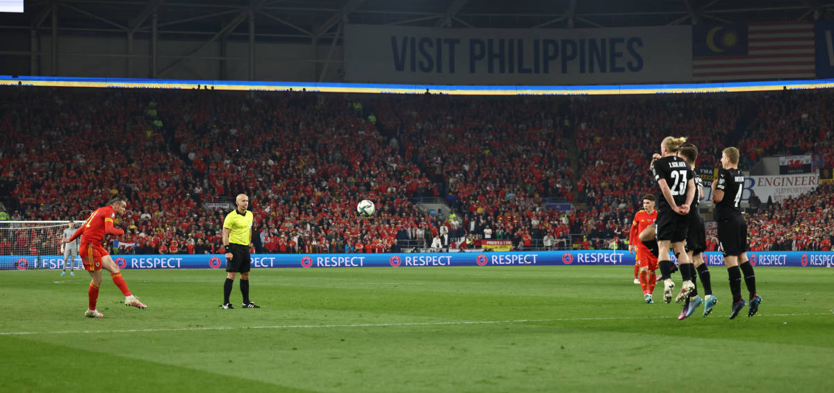 Gareth Bale pictured striking a free-kick which gave Wales a 1-0 lead over Austria in a 2022 World Cup qualifier