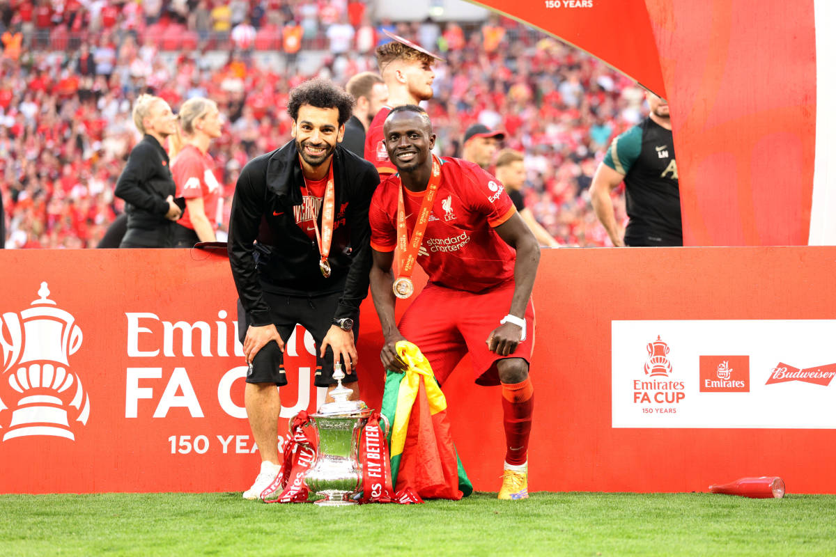 Mo Salah (left) pictured with Sadio Mane and the FA Cup trophy after Liverpool's victory over Chelsea in the 2022 final at Wembley