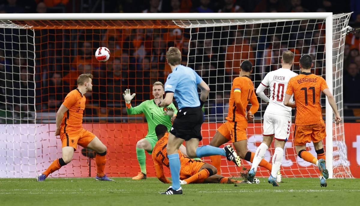 Christian Eriksen (no.10) scores for Denmark against Holland with his first touch in international football in over nine months