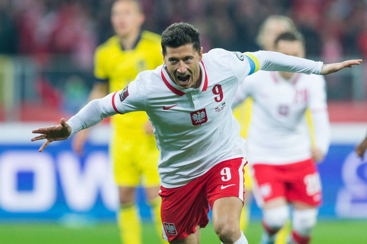 Robert Lewandowski celebrates scoring a goal for Poland against Sweden in a 2022 World Cup qualifying playoff