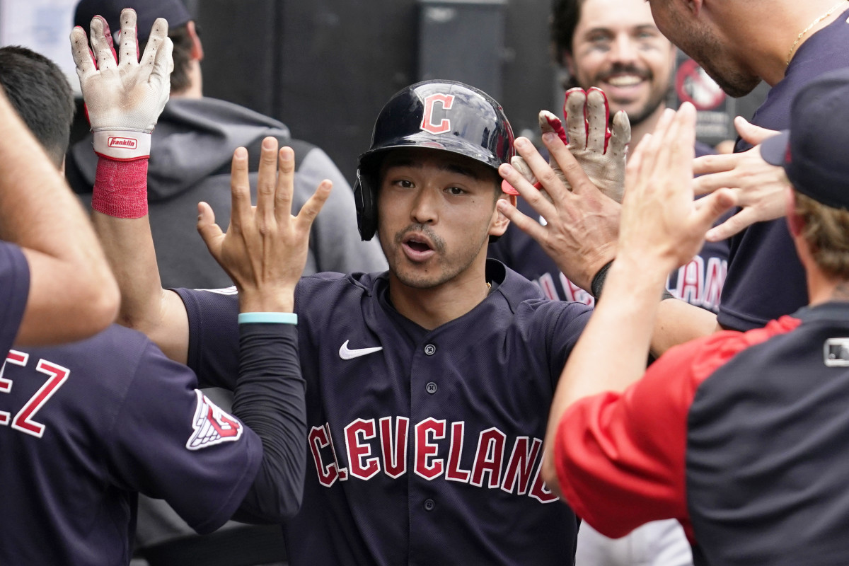 Cleveland Guardians’ Steven Kwan celebrates with teammates after hitting a solo home run during the ninth inning of a baseball game against the Chicago White Sox in Chicago, Sunday, July 24, 2022.