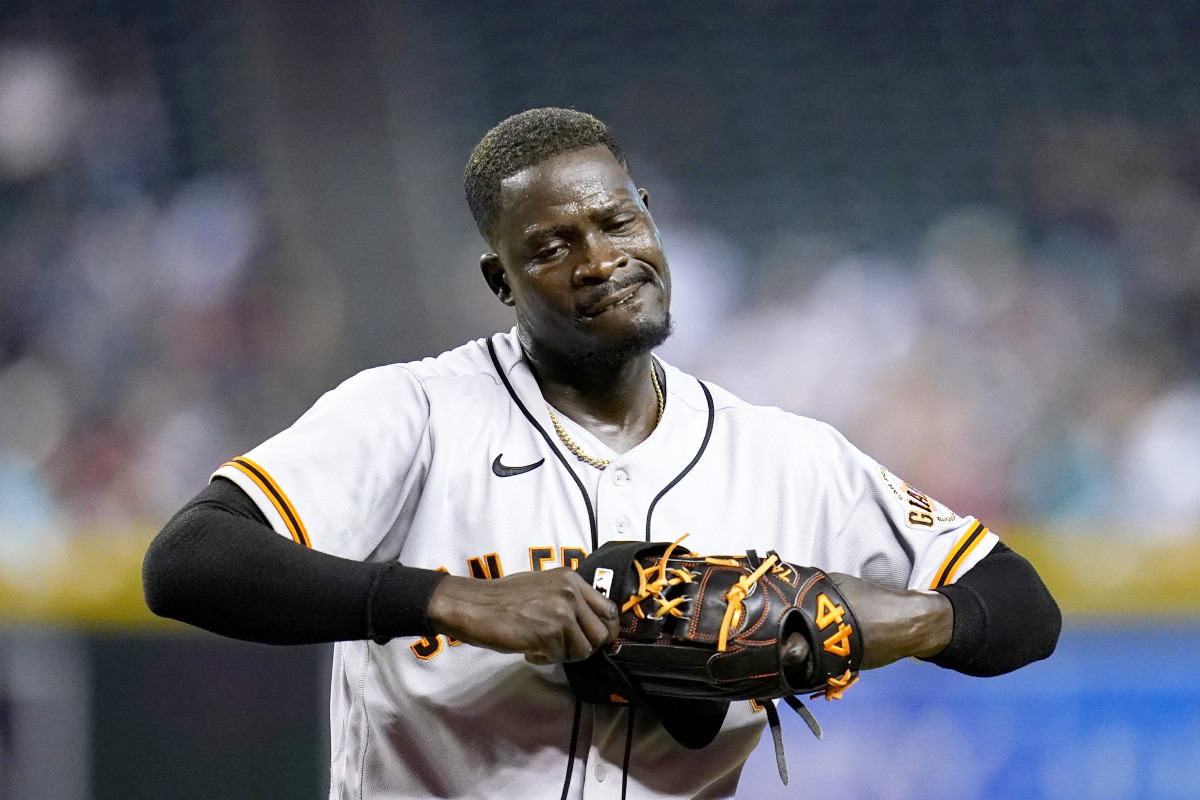 San Francisco Giants relief pitcher Yunior Marte walks off the field after being replaced during the eighth inning of a baseball game against the Arizona Diamondbacks Tuesday, July 26, 2022, in Phoenix. The Diamondbacks won 7-3.