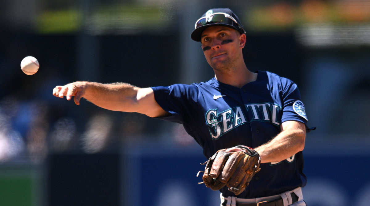 Adam Frazier throws a ball at second base for the Mariners
