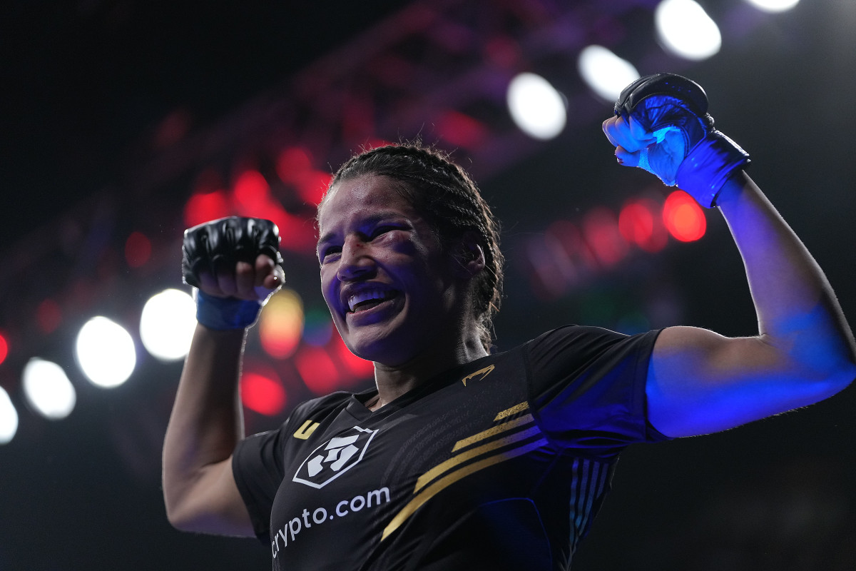 Julianna Peña celebrates her victory by submission against Amanda Nunes during UFC 269 at T-Mobile Arena.