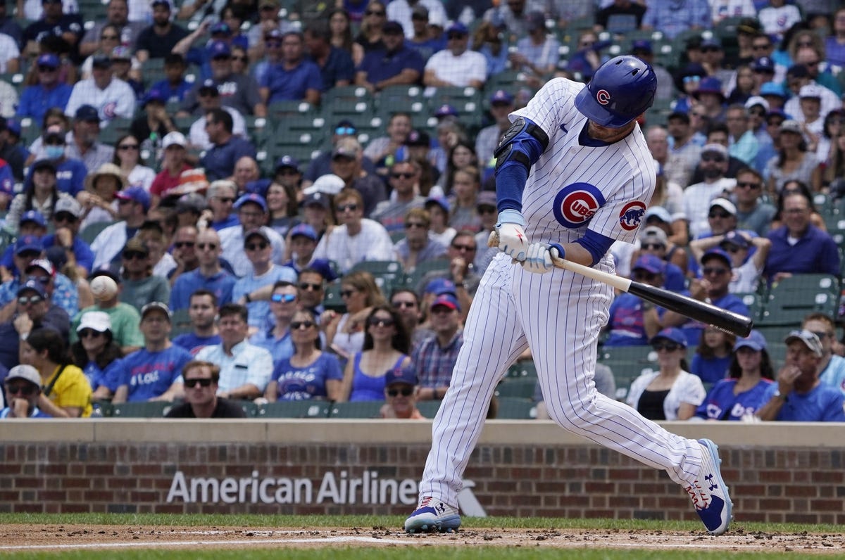 Jul 26, 2022; Chicago, Illinois, USA; Chicago Cubs left fielder Ian Happ (8) hits a two run double against the Pittsburgh Pirates during the first inning at Wrigley Field. Mandatory Credit: David Banks-USA TODAY Sports