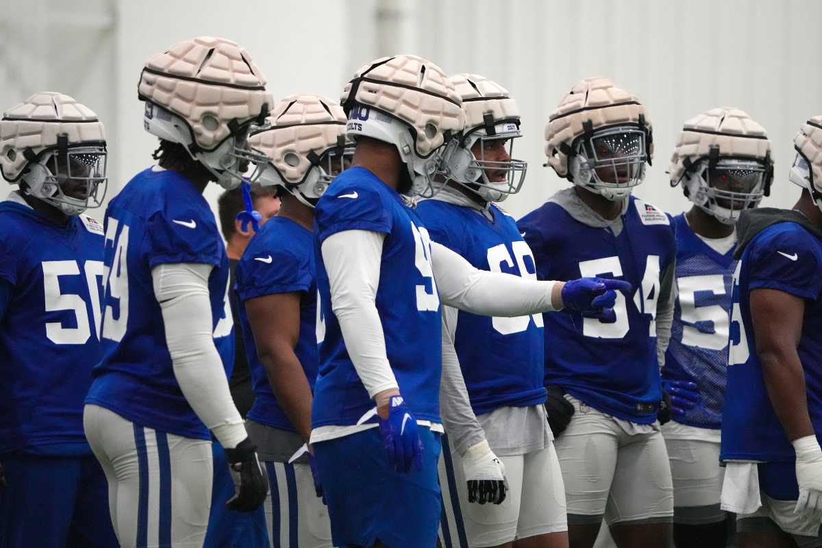 Indianapolis Colts players wear protective head gear over their helmets during training camp Wednesday, July 27, 2022, at Grand Park Sports Campus in Westfield, Ind. Indianapolis Colts Training Camp Nfl Wednesday July 27 2022 At Grand Park Sports Campus In Westfield Ind