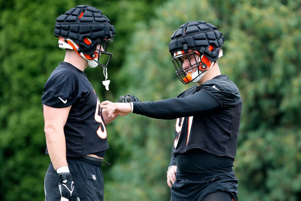 Cincinnati Bengals defensive ends Sam Hubbard (94) and Trey Hendrickson (91) face off in a drill during the first day of preseason training camp at the Paul Brown Stadium training facility in downtown Cincinnati on Wednesday, July 27, 2022. Cincinnati Bengals Training Camp