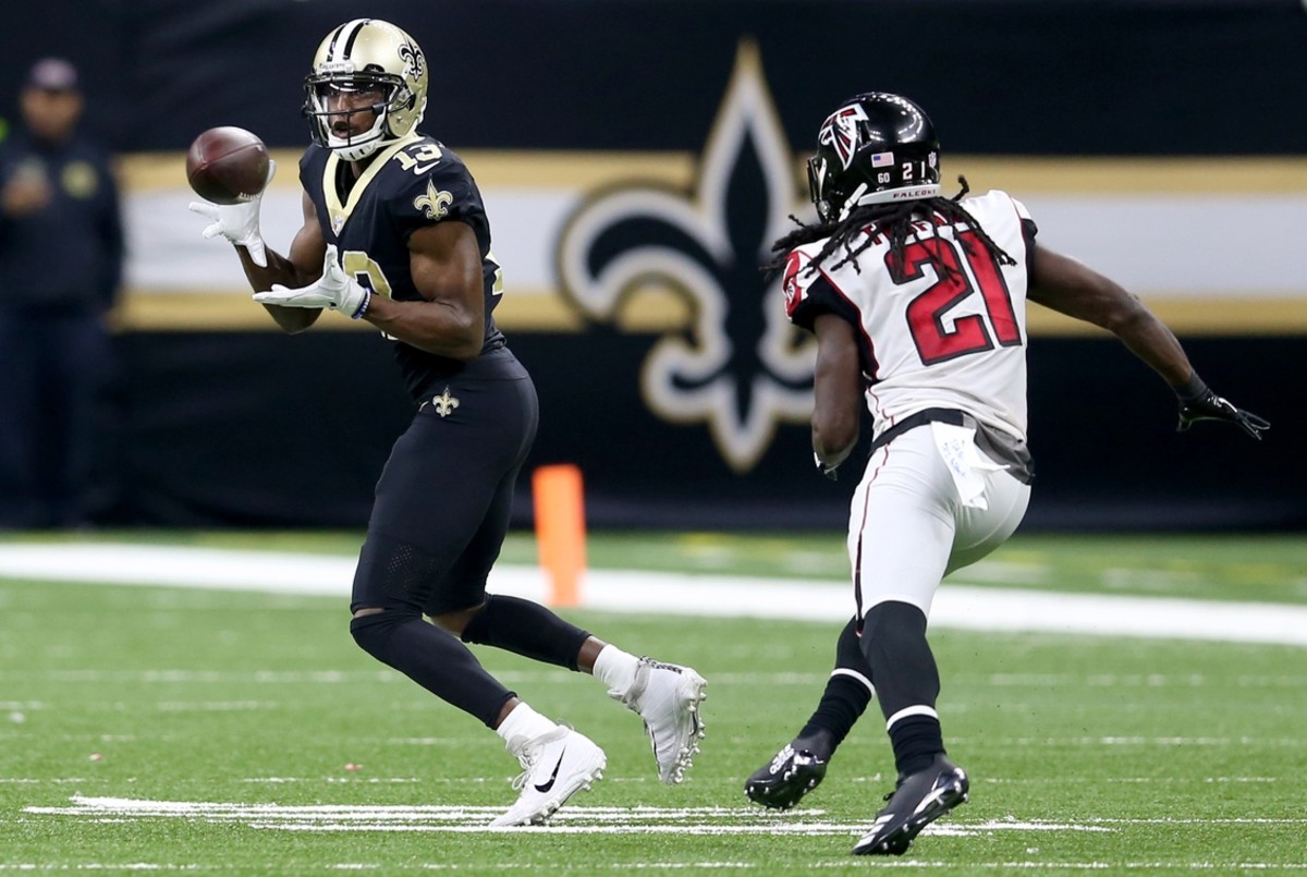 New Orleans Saints receiver Michael Thomas (13) makes a catch over Falcons cornerback Desmond Trufant (21). Mandatory Credit: Chuck Cook-USA TODAY Sports