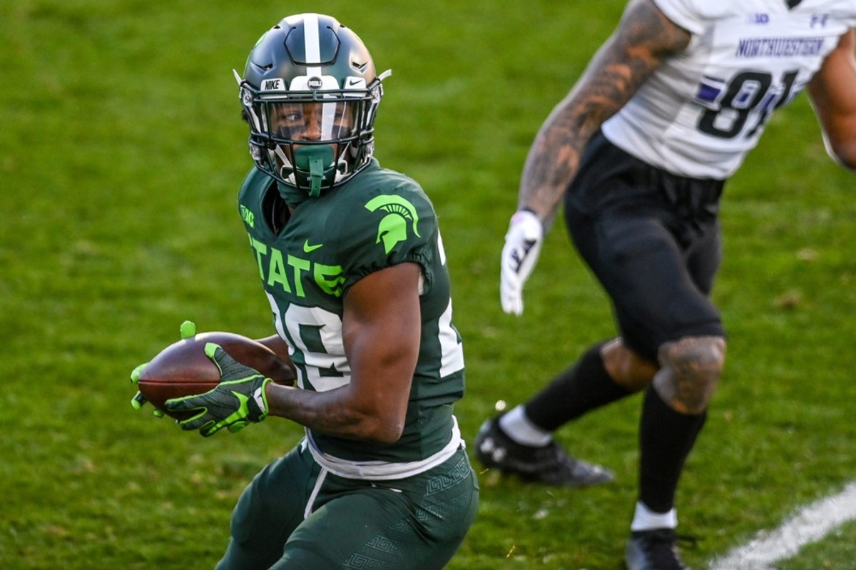 Michigan State's Shakur Brown returns an interception against Northwestern during the first quarter on Saturday, Nov. 28, 2020, at Spartan Stadium in East Lansing.