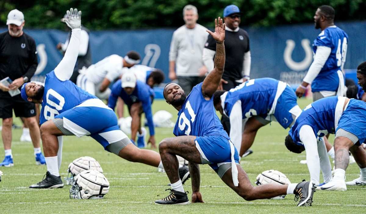 Jelani Woods (80) and Yannick Ngakoue (91) stretch during the Indianapolis Colts mandatory mini training camp on Wednesday, May 8, 2022, at the Indiana Farm Bureau Football Center in Indianapolis.