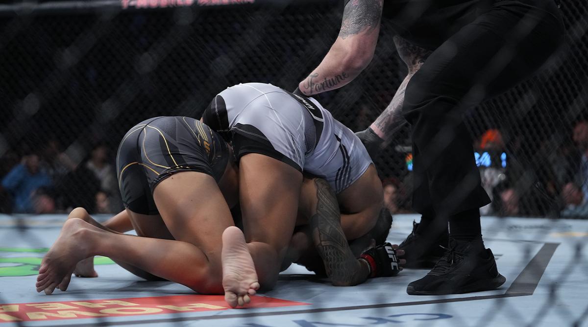 Dec 11, 2021; Las Vegas, Nevada, USA; Julianna Pena applies a hold against Amanda Nunes during UFC 269 at T-Mobile Arena.