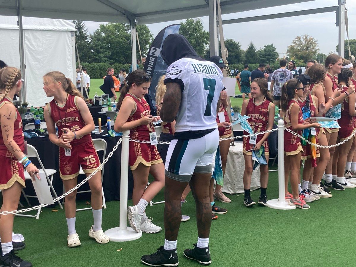 Haason Reddick signing autographs after practice on July 29, 2022