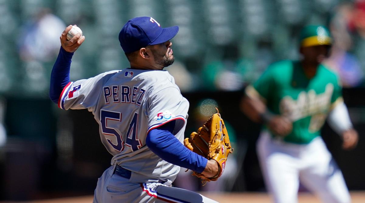 Texas Rangers’ Martín Perez pitches against the Oakland Athletics during the sixth inning of a baseball game in Oakland, Calif., Sunday, July 24, 2022.