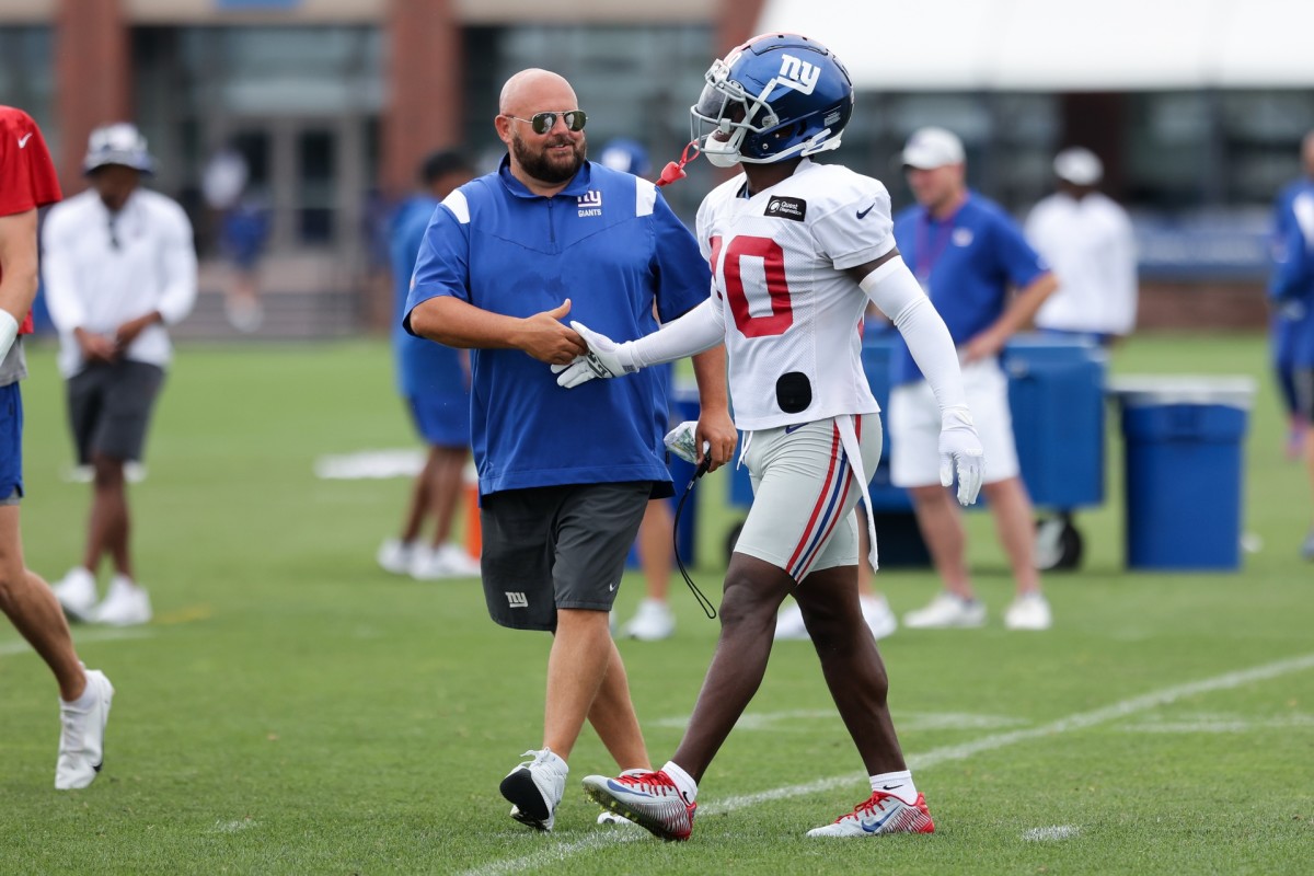 Jul 29, 2022; East Rutherford, NJ, USA; New York Giants head coach Brian Daboll shakes hands with cornerback Darnay Holmes (30) after an interception during training camp at Quest Diagnostics Training Facility.