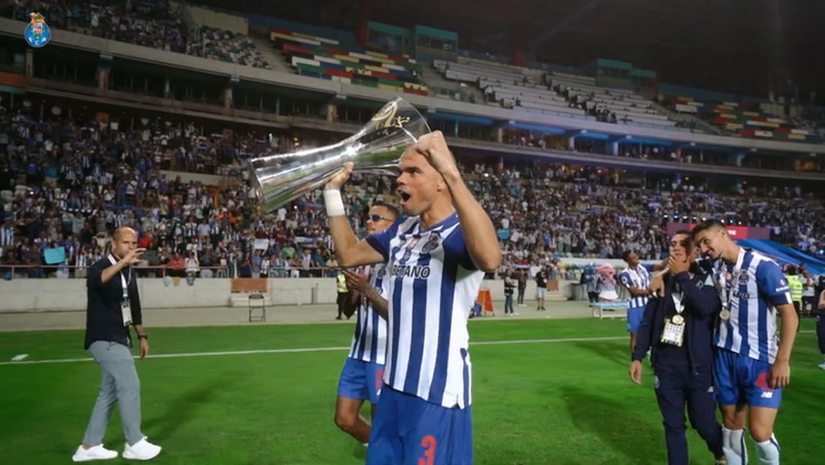 Porto players celebrate as they lift the trophy after beating